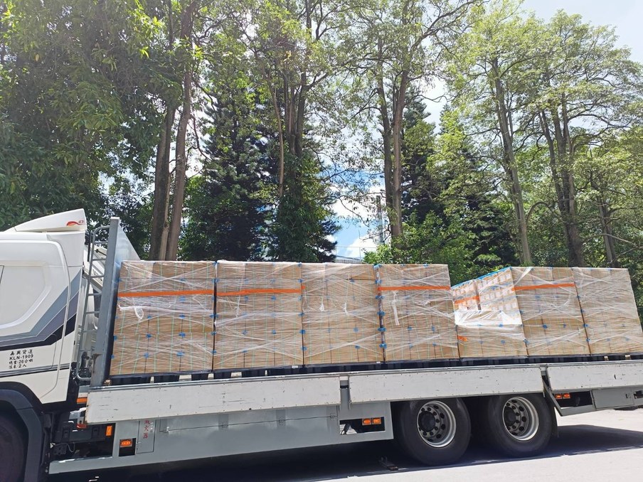 Palletised BubblePhil bubble tea ingredients shrink-wrapped and loaded on a truck for consolidated container export