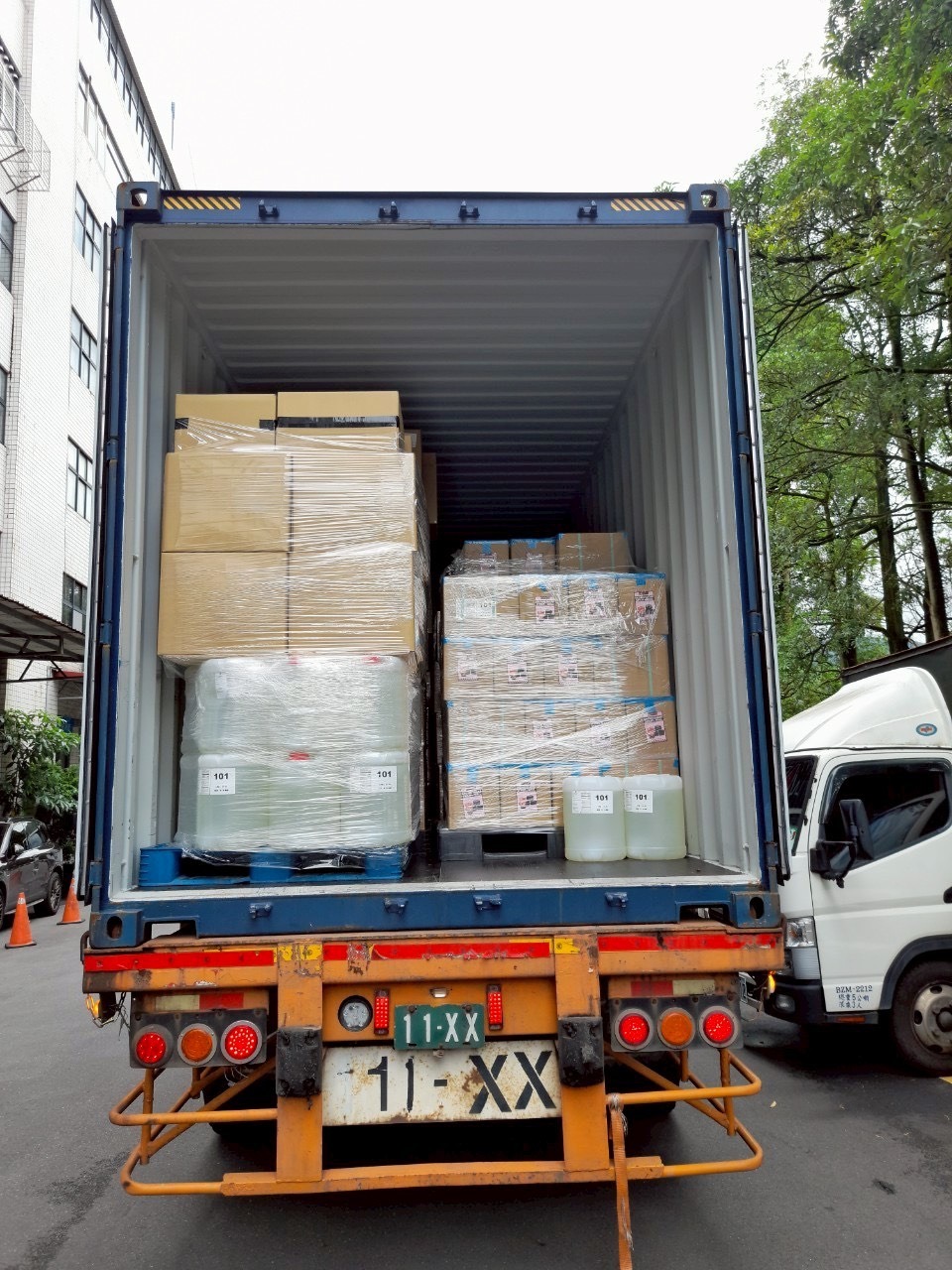 Export container loaded with palletized, shrink-wrapped cartons of bubble tea ingredients