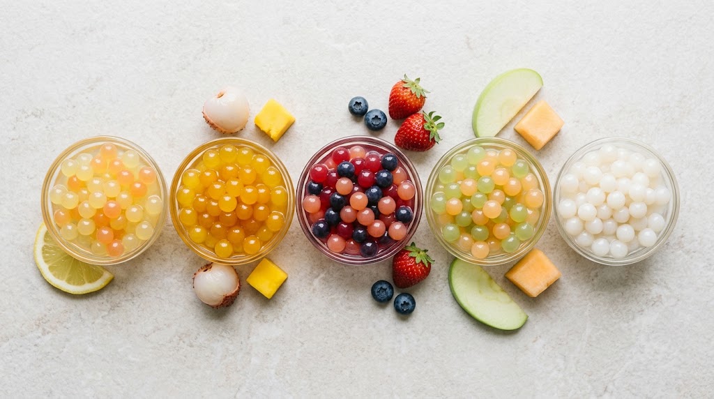 Popping boba in five color groups representing the citrus, tropical, berry and stone fruit, orchard and melon, and creamy flavor series
